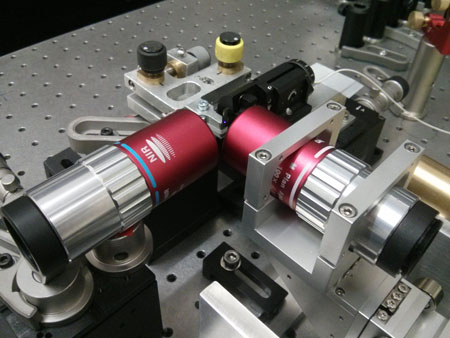 The image shows the ultrafast photomodulation spectroscopy technique