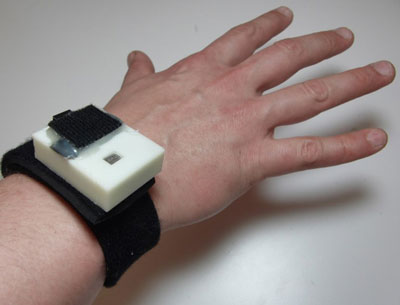 Neoprene wrist strap with ABS plastic shell containing the circuitry for measuring ozone concentration, PPG, motion, temperature, and humidity