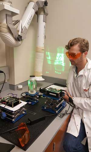 SMU chemist Dr. Alex Lippert prepares to demonstrate the 3-D light pad 