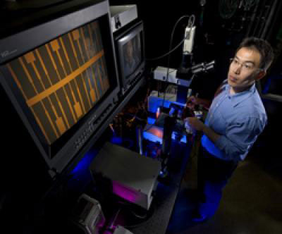 Sandia researcher Xinjian Zhou measures the electronic and optical properties of carbon nanotube devices in a probe station