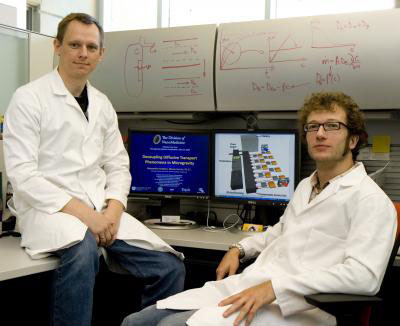 UT nano scientists Arturas Ziemys, Ph.D., left, and Alessandro Grattoni are readying an experiment that will be tested in space