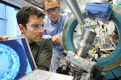 University of Chicago scientist Rafael Jaramillo and Argonne scientist Yejun Feng examine the element chromium at the Advanced Photon Source. Studying simple metallic chromium, the joint UC-Argonne team has discovered a pressure-driven quantum critical regime and has achieved the first direct measurement of a 