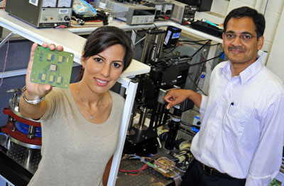Purdue University doctoral student Tannaz Harirchian holds up special chips provided by Delphi Electronics and Safety that she and Professor Suresh Garimella used to simulate what happens in a real chip