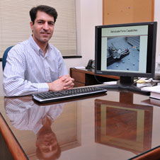 Associate mechanical and industrial enginnering professor Nader Jalili displays an image of a nanorobot on his office computer