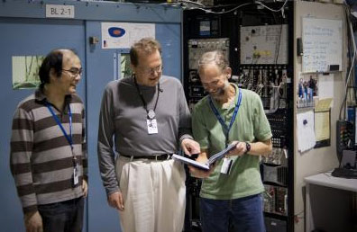 Researchers including Hirohito Ogasawara (left), Anders Nilsson (center), and Mike Toney (right) used the bright X-ray beam at SLAC's Stanford Synchrotron Radiation Lightsource to study a new form of platinum that could be used to make cheaper, more efficient fuel cells.