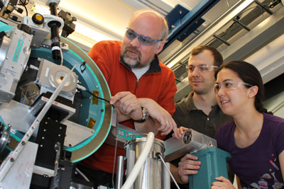 Thomas Proffen, left, of Los Alamos National Laboratory, and Peter Chupas and Karena Chapman of Argonne National Laboratory examine the high-energy X-ray beamline 11-ID-B at Argonne's Advanced Photon Source facility