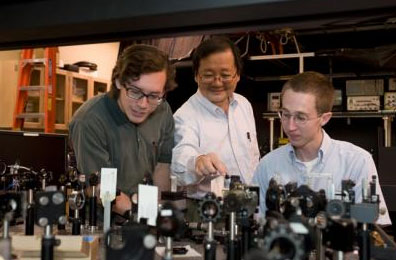 Washington State University chemist Choong-Shik Yoo, seen here with students, has used super-high pressures to create a compact, never-before-seen material capable of storing vast amounts of energy