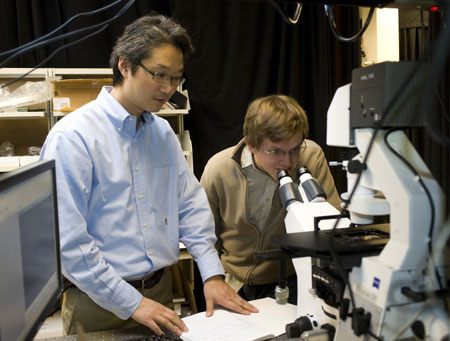 Jong Hyun Choi, an assistant professor of mechanical engineering at Purdue, and doctoral student Benjamin Baker use fluorescent imaging to view a carbon nanotube
