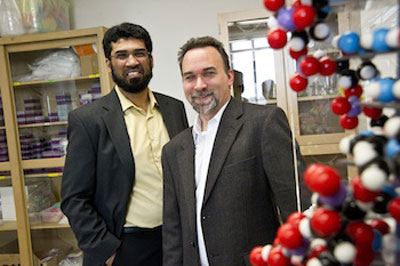 Samir Iqbal (left) electrical engineering assistant professor, and Shawn Christensen, assistant professor in biology
