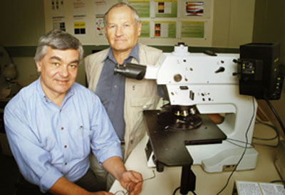 Professor Andrei Rode in the lab with colleague Dr Eugine Gamaly