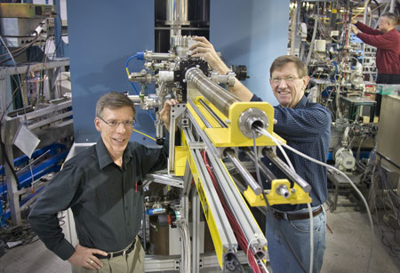 Dan Fischer (left) and Raymond Browning show off the prototype of the Vector Potential Photoelectron Microscope