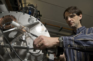 NSCL senior physicist Daniel Bazin adjusts the laboratory's National Science Foundation-funded radio frequency fragment separator, which allows boosts the ability to to search for proton-rich rare isotopes