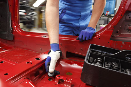 Automobile workers use a 3D-printed thumbling