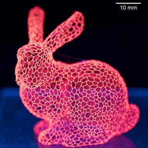 A 3-D printed bunny made of isomalt sugar mixed with a glowing red dye