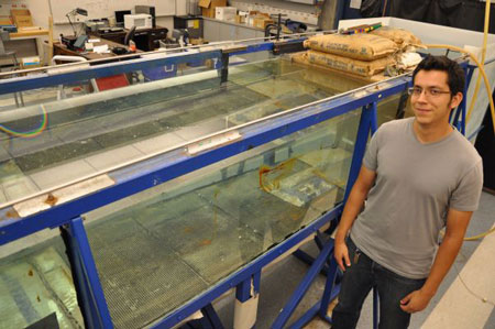 Raul Delga Delgadillo stands in front of the flow tank he will use in his research