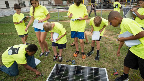 students interact with the Hybrid Sterling Energy Generator (HySterE) panel
