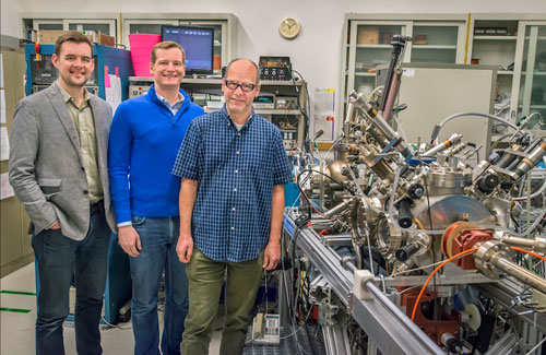 Dan Riley, Jared Schwede, and Andreas Schmid next to a spin-polarized low-energy electron microscope