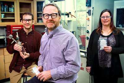 Geoffrey Coates, center, in his lab with James Eagan, and researcher Anne LaPointe