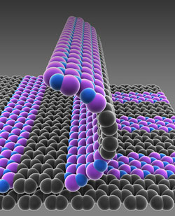 Schematic illustration of single-atom-thick films with patterned regions of conducting graphene (gray) and insulating boron nitride (purple-blue).
