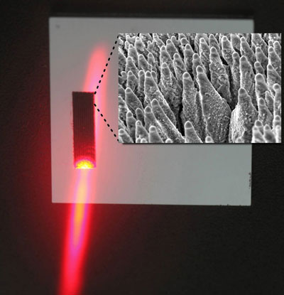 Black silicon is irradiated with a laser. Small image: Black silicon, magnified
