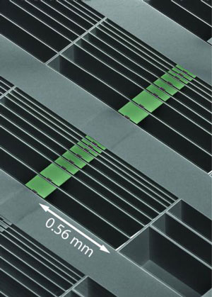 array of optomechanical accelerometer devices formed in the surface of a silicon microchip