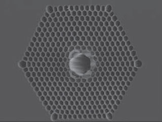 Electron microscope photo of a cross-section of photonic bandgap fiber
