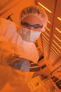A student conducts research in UC Riverside's clean room