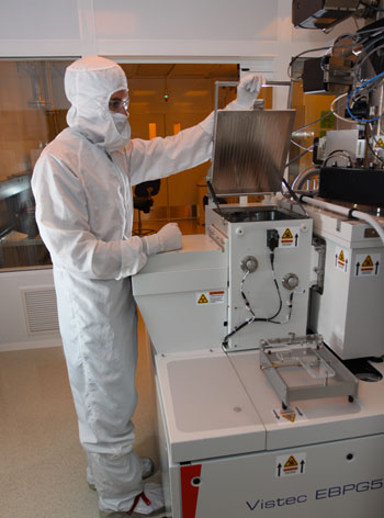 Ryan Anderson prepares to remove a sample from the Vistec EBPG5200 electron beam writer
