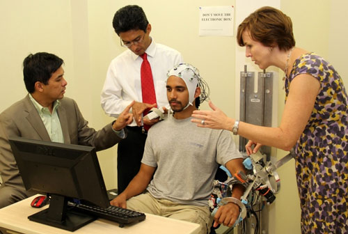 From left, Gerard Francisco, José Luis Contreras-Vidal and Marcia O'Malley work with a University of Houston (UH) graduate student testing MAHI-EXO II, a robotic rehabilitation device
