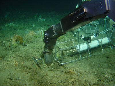 remotely operated vehicle installs a flowmeter at the sea floor