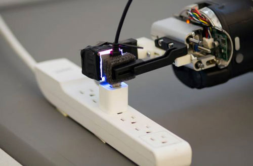 Armed with the GelSight sensor, a robot can grasp a freely hanging USB cable and plug it into a USB port
