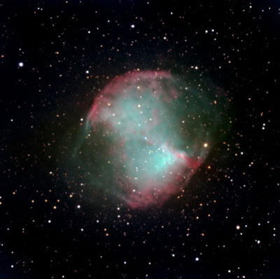 Birth of a white dwarf (bright spot at the center) in the Dumbbell Nebula