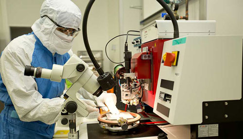 Lawrence Livermore National Laboratory engineer Kedar Shah works on a neural device