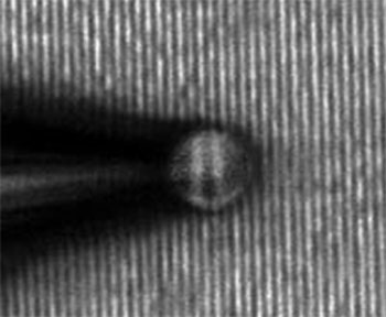 A microsphere connected to the end of a pipette enables sub-diffraction-limit imaging