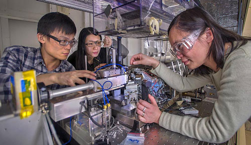Jiajun Wang, Karen Chen and Jun Wang prepare a sample for study at NSLS beamline X8C