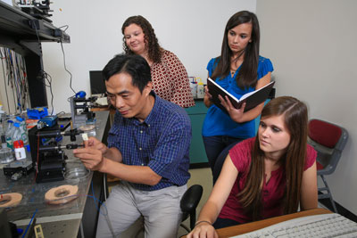 From left, Taylor Bono, Dr. Yongbin Lin, Mollye Sanders and Savannah Kaye