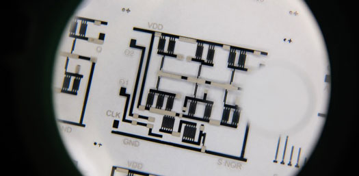 A low-cost complex electronic circuit printed on a transparent plastic sheet