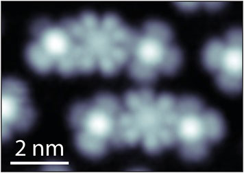 Scanning tunneling microscopy (STM) image of cobalt phthalocyanine (CoPC) molecules in two different charge states