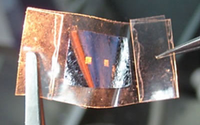 Aluminum film with two optical sensors over a Scotch adhesive tape
