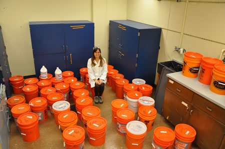 Alicia Taylor surrounded by buckets 