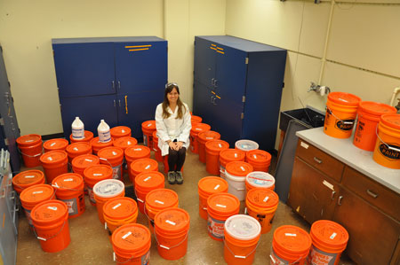Alicia Taylor surrounded by buckets