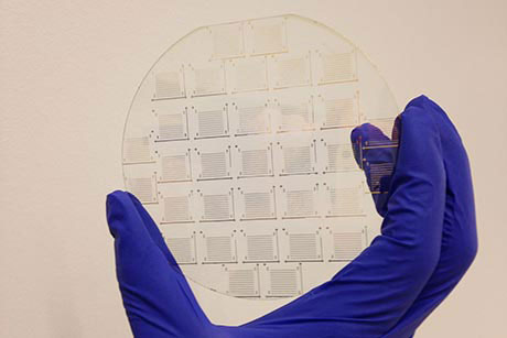 A molybdenum disulphide device array on a transparent silica wafer.