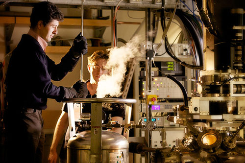 University of British Columbia physicists Andrea Damascelli, left, and Giorgio Levy, working with liquid helium