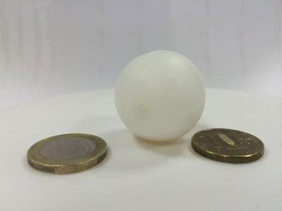 table tennis ball and coins