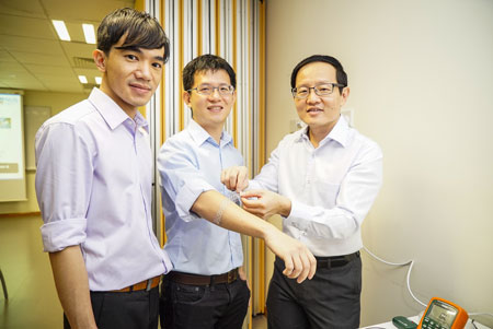 researchers with flexible sensor