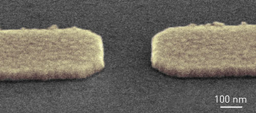 The narrow constriction in a quantum point contact (defined by the two contacts on the substrate) gives rise to quantum phenomena