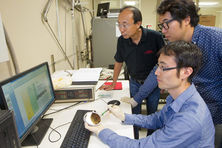 Professor H.-S. Philip Wong, left, graduate student Joon Sohn and postdoctoral fellow Seunghyun Lee (seated)