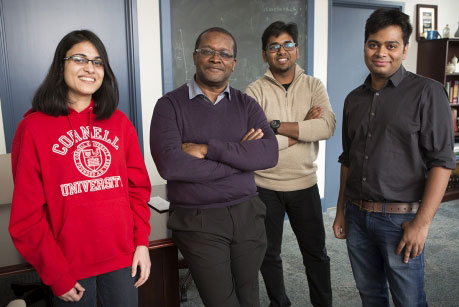 Lynden Archer in a classroom with graduate students Akanksha Agrawal, left, Rahul Mangal and Snehashis Choudhury.