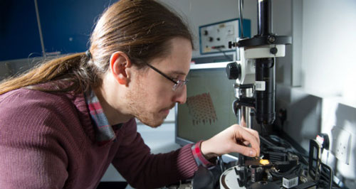 Nacho Martín-Fabiani preparing a paint sample for analysis with the Atomic Force Microscope
