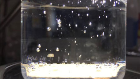 Water splitting on a particulate photocatalyst sheet